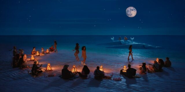 A scene from the 2023 movie "Barbie," featuring a nighttime beach setting under a full moon. People are gathered in small groups, sitting by campfires arranged in an arc. They are playing musical instruments, while some girls are seen leaving their partners and walking over to new partners, creating a dynamic and communal atmosphere by the sea.