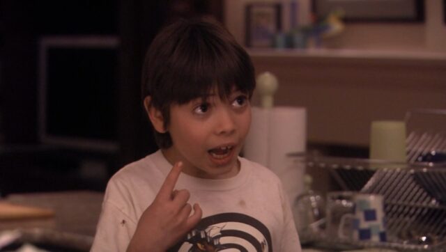 Shane, a young boy from the TV series "Weeds," pointing to his right eye while speaking.