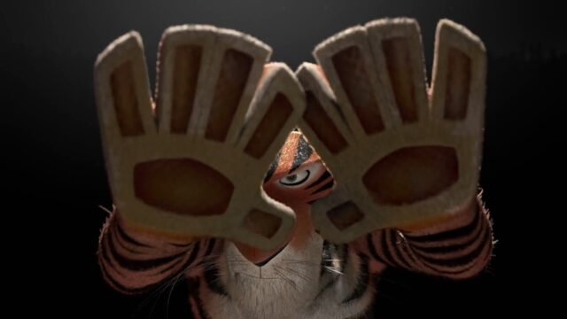 A tiger, Vitaly, forms a triangular shape with his paws, peering through it with one focused eye in a dramatic moment from the animated film "Madagascar 3: Europe’s Most Wanted" (2012).