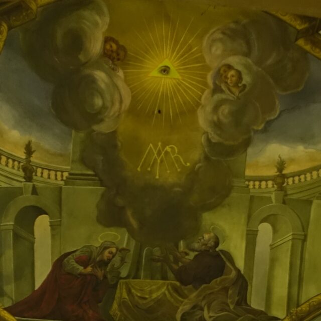 A painting on the apse chapel ceiling in the Cathedral Basilica of the Assumption in Lviv, Ukraine, depicting the Eye of God within a glowing triangle, surrounded by rays of light and clouds. Four cherubic faces emerge from the clouds, while below, two religious figures kneel in reverence, set within a classical architectural backdrop.