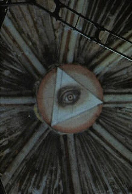 The Eye of Providence depicted in the dome ceiling of Santiago de Compostela, Spain. The eye is enclosed within a triangle, set against a circular background with rays of light extending outward.