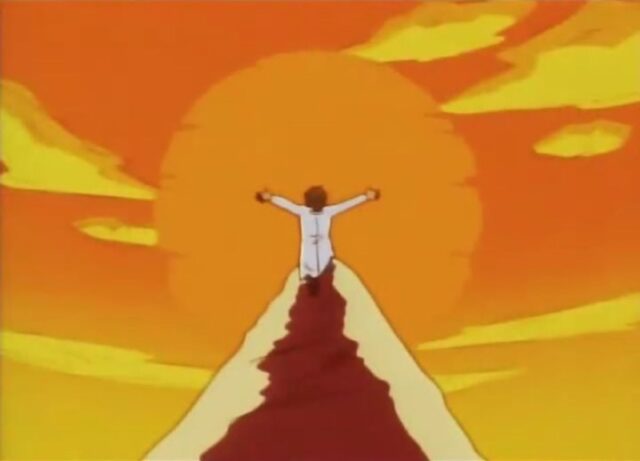 Seymour with arms outstretched in a T-pose at the top of a pointed hill with the sun behind him, evoking imagery reminiscent of a cross and an Illuminati-like symbol.