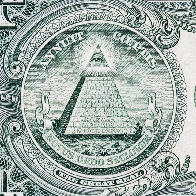 The image shows the back of a US one-dollar bill, which is derived from the reverse side of the Great Seal of the United States. It features an unfinished pyramid with 13 steps, depicted in green. At the top of the pyramid is the Eye of Providence, enclosed in a triangle and surrounded by rays of light. Above the pyramid is the Latin phrase "Annuit Coeptis," meaning "He (God) has favored our undertakings," written in green. Below the pyramid is another Latin phrase, "Novus Ordo Seclorum," meaning "New Order of the Ages," also in green. The base of the pyramid displays the date "MDCCLXXVI" (1776) in Roman numerals. The entire design is set within an intricate green border.