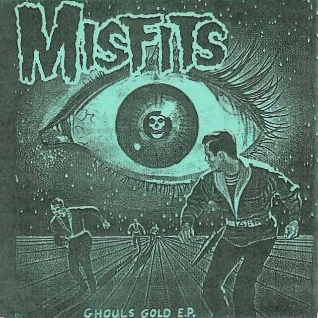 Cover art for "Ghouls Gold E.P." by Misfits (1988), featuring a large, eerie eye with long eyelashes dominating the background. Inside the eye's pupil is a skull symbol. In the foreground, several figures are running across a surreal, grid-like landscape, seemingly trying to escape the eye's gaze. The band's name, "Misfits," is prominently displayed at the top in distorted lettering.