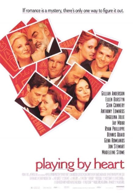 The movie poster for "Playing by Heart" (1998) features a collage of red-tinted photographs of the film's characters in the shape of a love heart. The tagline at the top reads, "If romance is a mystery, there's only one way to figure it out." The title "Playing by Heart" is written in red at the bottom, with the cast names listed on the right side of the poster.