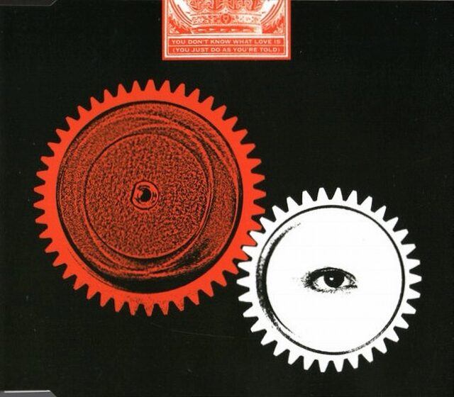 Cover art featuring two gears, one red and one white with an eye in the center, for The White Stripes' single "You Don't Know What Love Is (You Just Do as You're Told)."