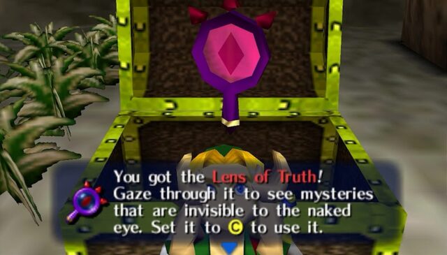 The player acquiring the "Lens of Truth" in The Legend of Zelda: Majora's Mask. It says that this item allows the player to see hidden objects and passages that are invisible to the naked eye. The Lens of Truth appears as a purple, octagonal lens with a glowing red center shaped like an eye. It has three small red spikes on the top of the lens. It is set in a metallic frame and is held in hand during use.